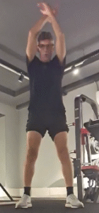Showing the Arm Crossover Swing exercise