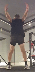 showing the Arm Crossover Swings exercise from the rear