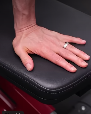 Showing the hand position for the bench dips exercise