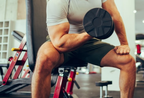 Showing the Dumbell Bicep Concentration Curl