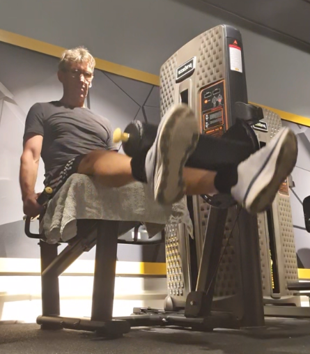 showing the leg extension gym exercise form