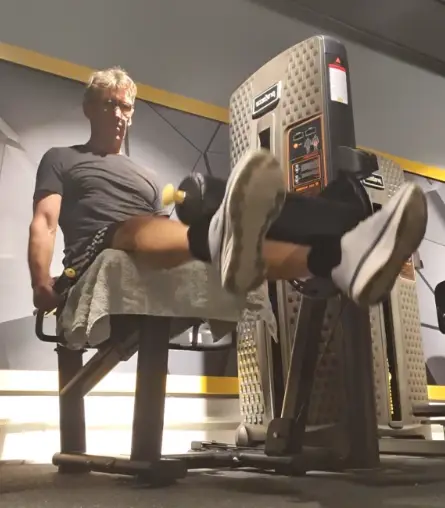 showing the leg extension gym exercise form