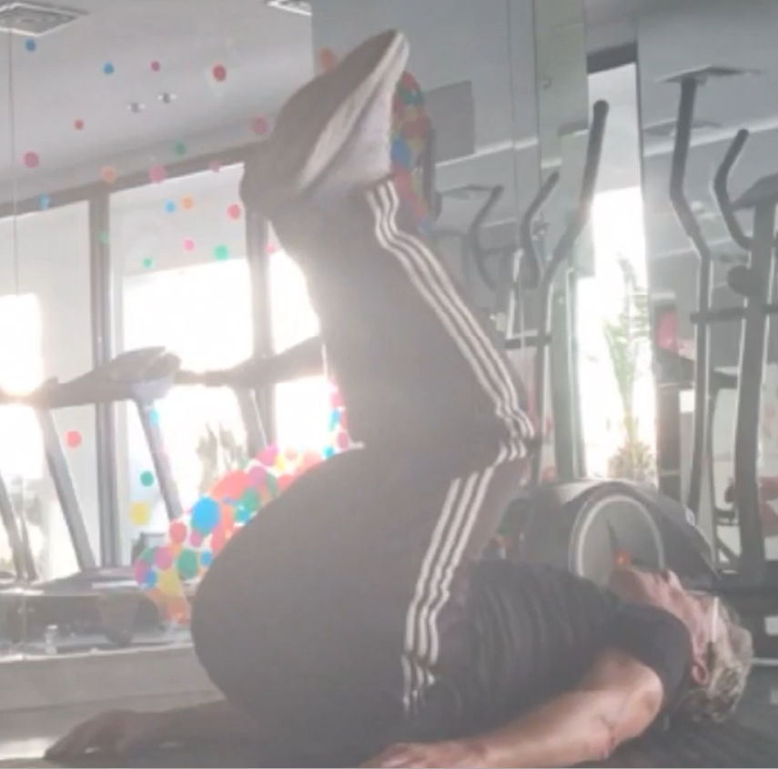 showing the Reverse Crunch Pilates Abs exercise