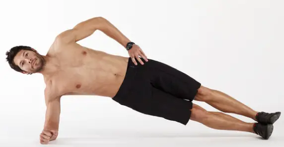 Showing the start position of the Pilates Side Plank, with hand on hip.