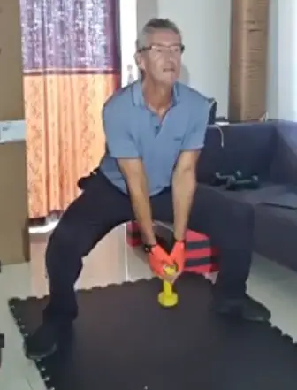 showing a still image from the dumbbell sumo squat video