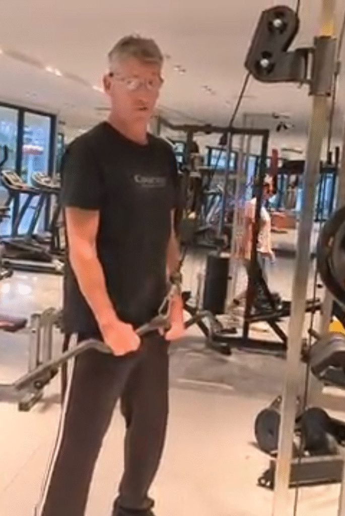 showing the Tricep Pulldown exercise at the bottom position