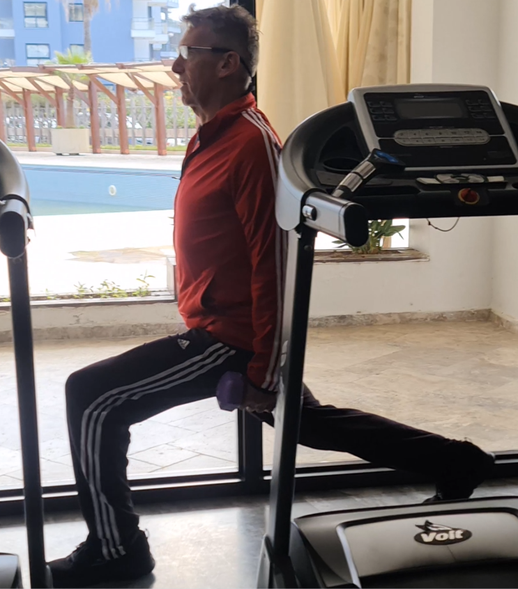 showing the walking dumbbell lunge exercise form