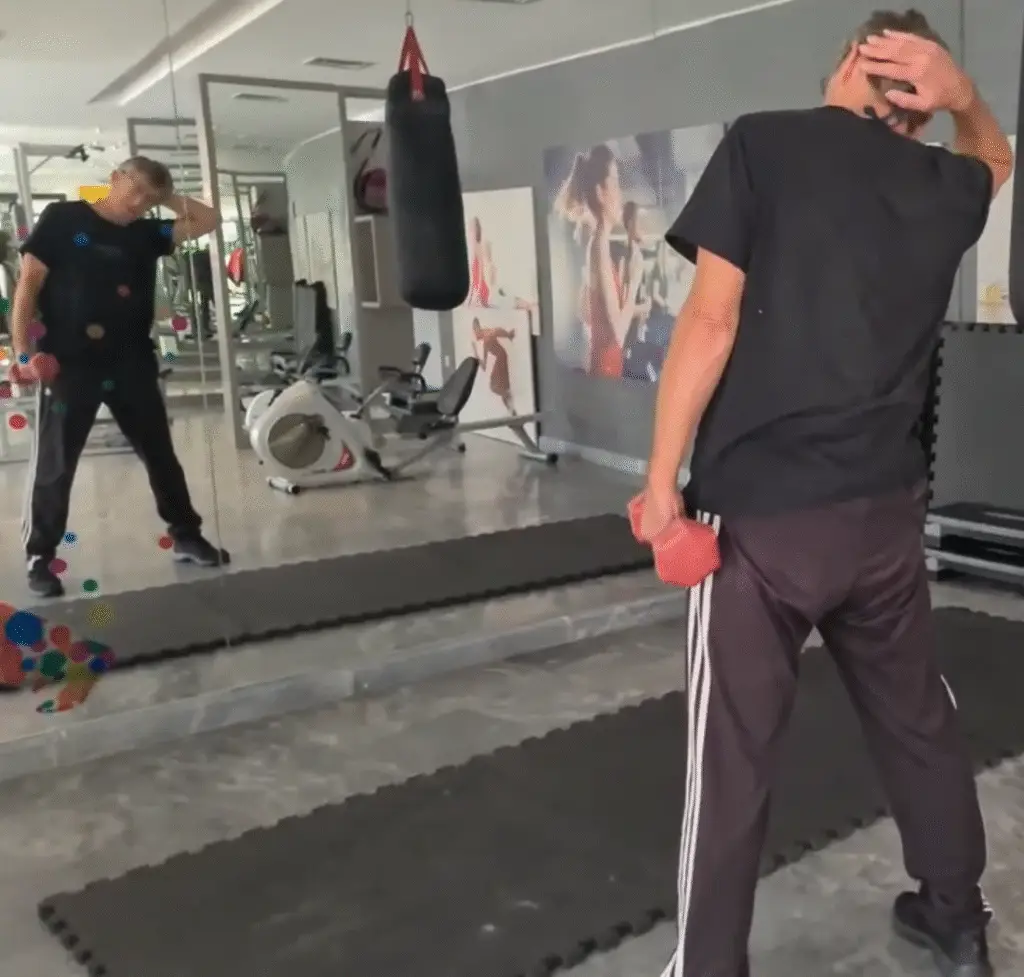 Showing the Dumbbell Side bend gym exercise