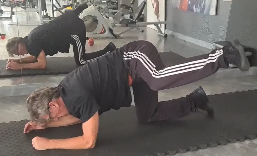 Showing the Fire Hydrant Pilates exercise