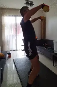Showing the Lateral Dumbbell Raise - side view - a shoulder exercise.
