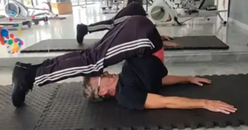 Showing the Plow or Halsana Yoga Stretch Exercise