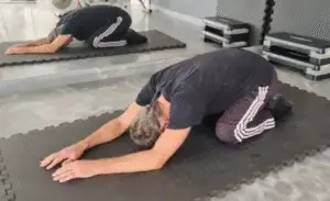 Showing the Prayer Stretch (or Child Pose)