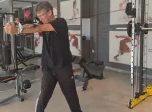 Showing the Cable Oblique Twist Gym Exercise