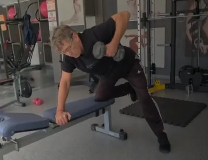 Showing a still image from the Dumbbell Bench Row video - a Gym Exercise for Back