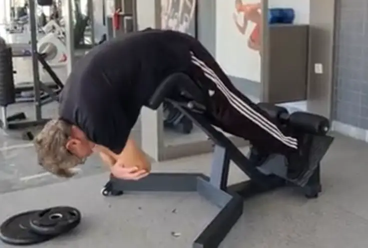 Showing the Hyperextension gym exercise for the lower back - start position.