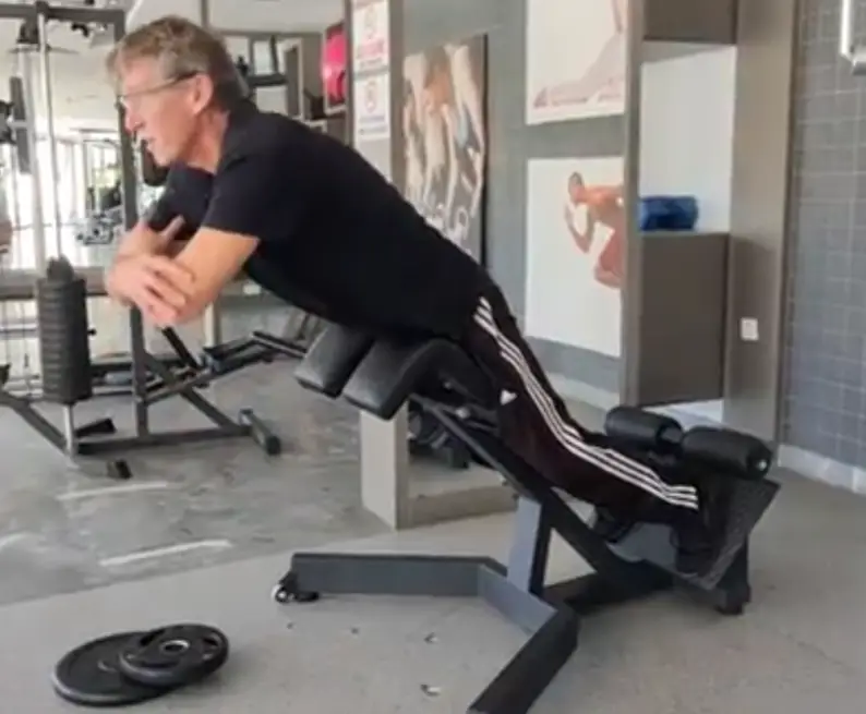 Showing the Hyperextension gym exercise for lower back - top position