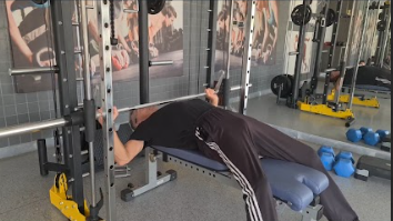Showing the Smith Machine Press gym exercise for Chest