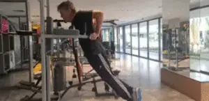 Shows a still image from the Bar Dip video - a gym exercise for Chest, Shoulders, & Triceps